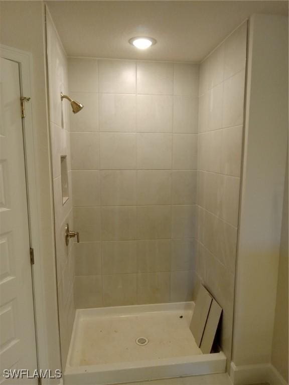 full bathroom featuring a stall shower