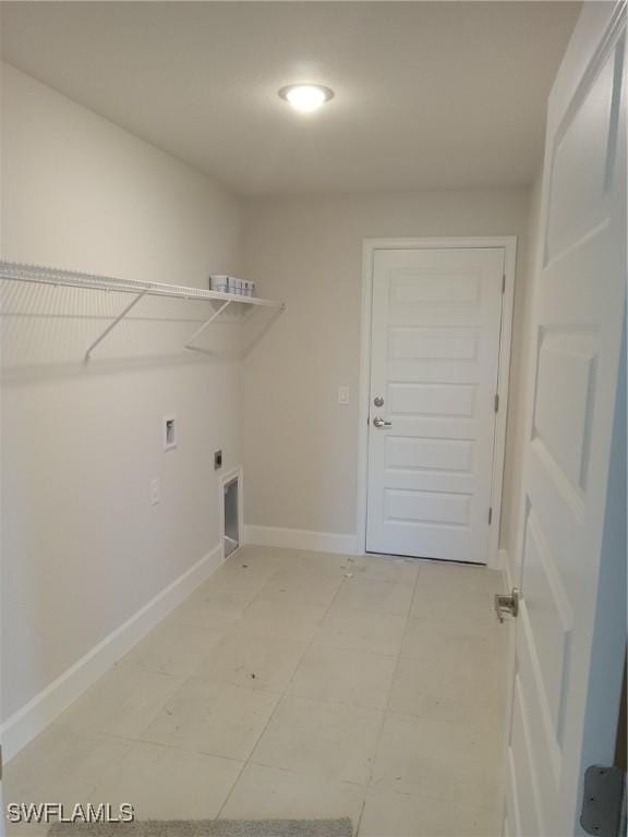 clothes washing area with laundry area, baseboards, washer hookup, and electric dryer hookup