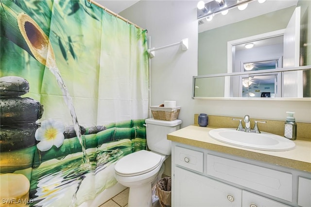 full bathroom featuring tile patterned flooring, vanity, and toilet