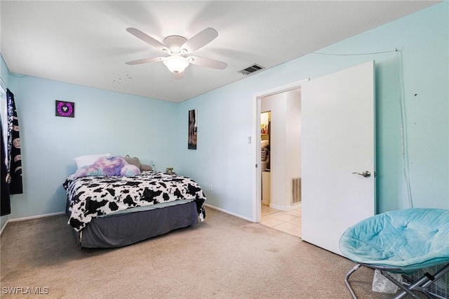 bedroom with a ceiling fan, visible vents, light carpet, and baseboards