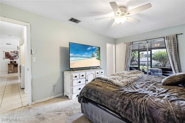 bedroom featuring light carpet, access to outside, visible vents, and separate washer and dryer