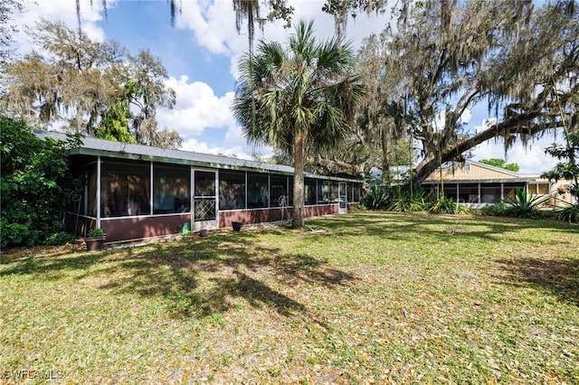 view of yard featuring a sunroom