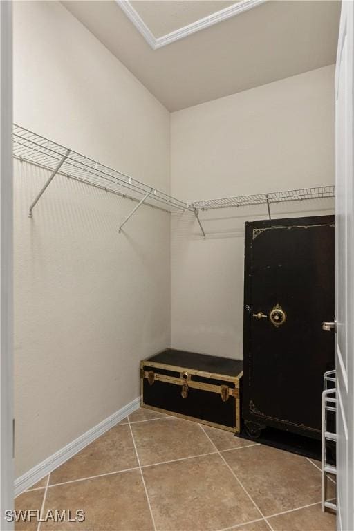 spacious closet with tile patterned flooring