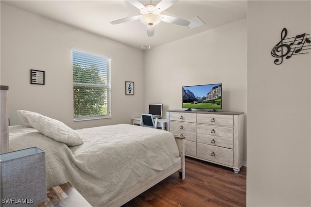 bedroom featuring ceiling fan and dark wood finished floors