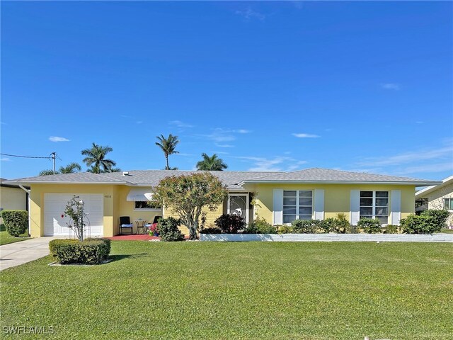 single story home featuring a front lawn, concrete driveway, an attached garage, and stucco siding