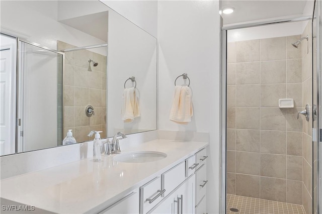 full bathroom with a stall shower and vanity