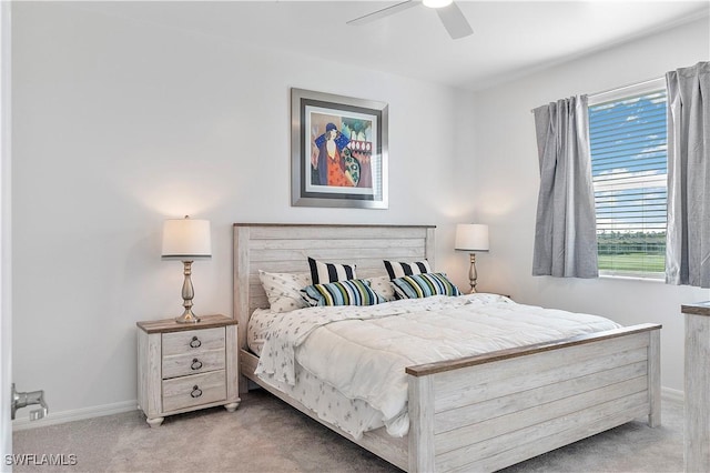 bedroom featuring ceiling fan, carpet flooring, and baseboards