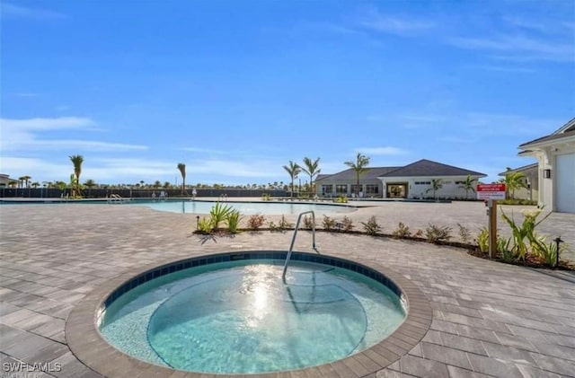 pool featuring a hot tub