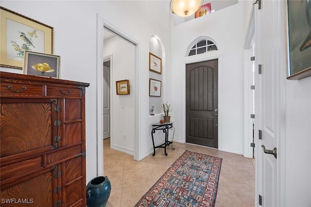 6574 Caldecott Dr, Naples, FL 34113 - entrance foyer with light tile patterned flooring and baseboards