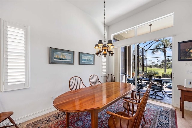 6574 Caldecott Dr, Naples, FL 34113 - dining room with baseboards and an inviting chandelier