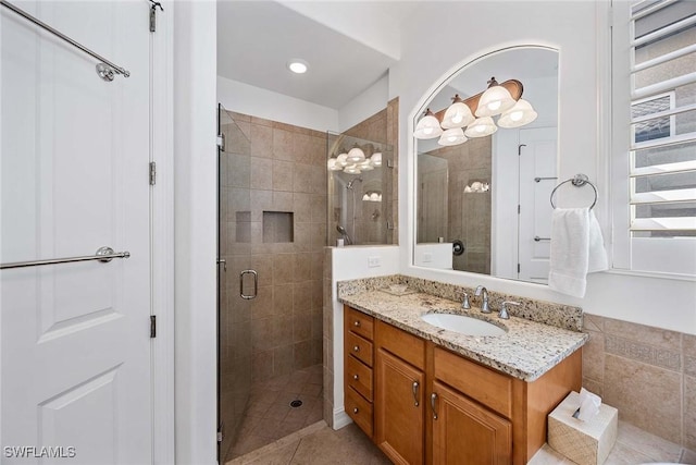 6574 Caldecott Dr, Naples, FL 34113 - bathroom with a stall shower, tile patterned flooring, and vanity