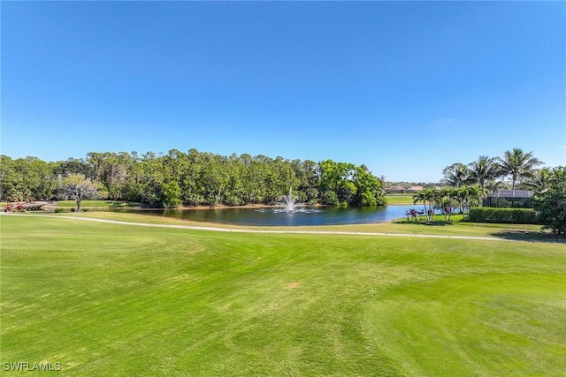6574 Caldecott Dr, Naples, FL 34113 - surrounding community with view of golf course, a water view, and a lawn