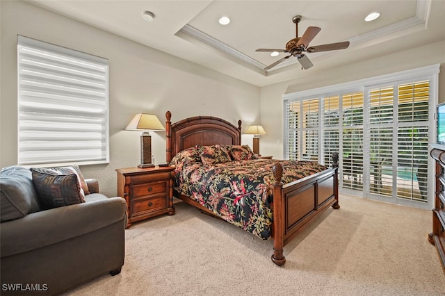 bedroom with recessed lighting, light colored carpet, access to exterior, a raised ceiling, and crown molding