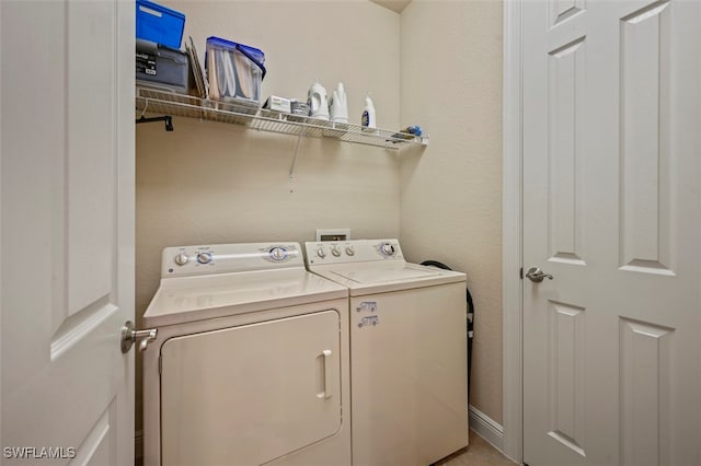 washroom with laundry area and independent washer and dryer