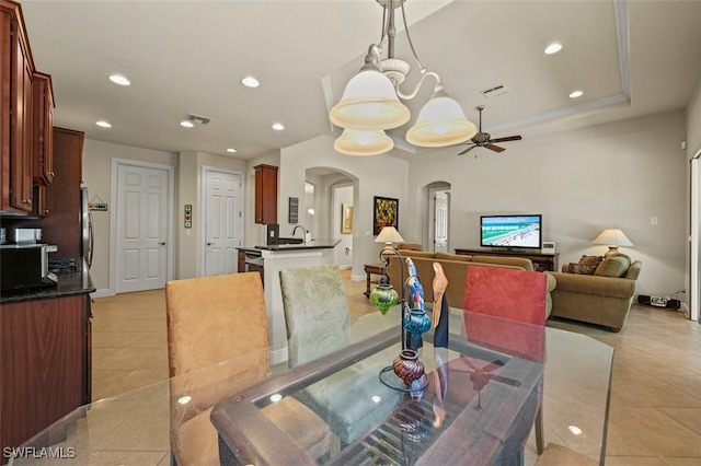 dining area featuring arched walkways, visible vents, recessed lighting, and light tile patterned floors