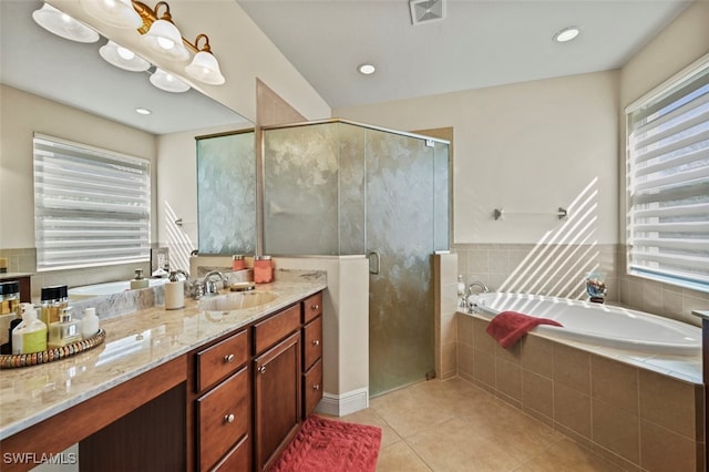 bathroom with a garden tub, a shower stall, visible vents, and tile patterned floors