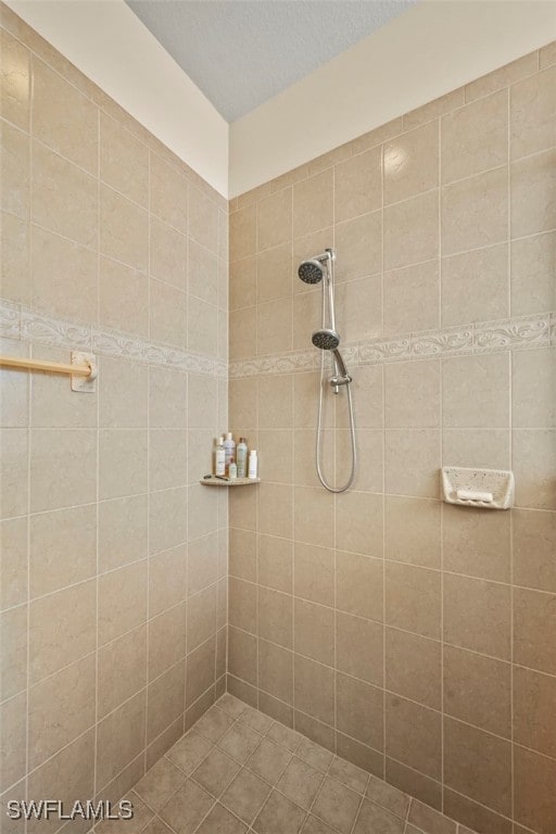 full bathroom with a tile shower