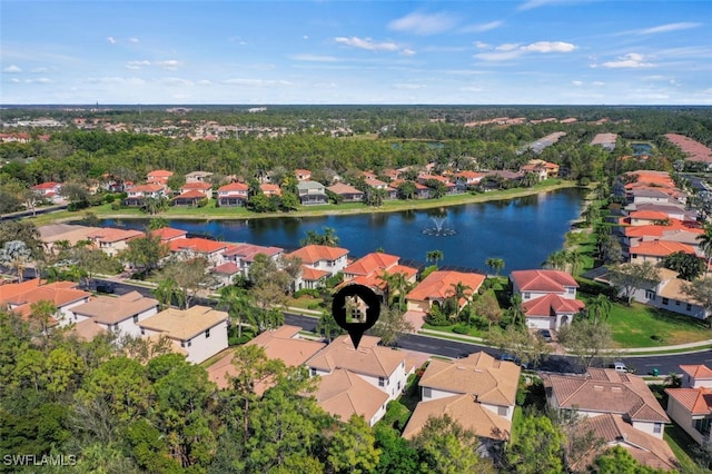 birds eye view of property with a residential view and a water view