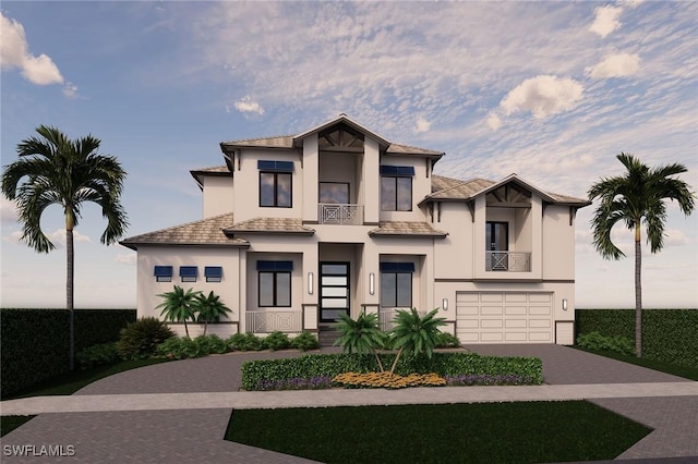 view of front of property with a balcony, a garage, decorative driveway, and stucco siding