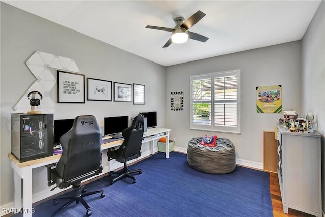 home office with ceiling fan, baseboards, and wood finished floors