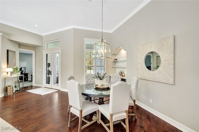 dining area with ornamental molding, french doors, baseboards, and wood finished floors