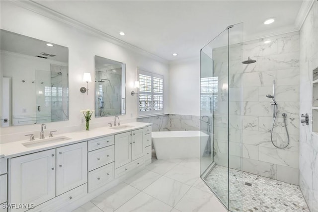 bathroom featuring a freestanding bath, a sink, a marble finish shower, and crown molding