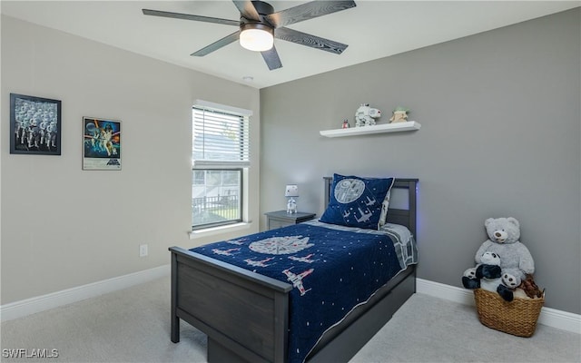 bedroom featuring carpet floors, a ceiling fan, and baseboards