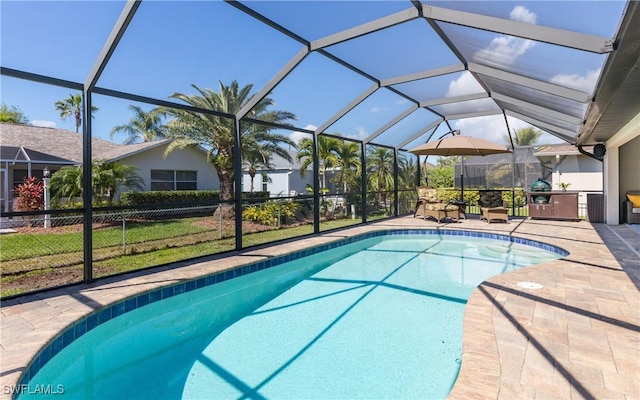 outdoor pool featuring a patio and a lanai