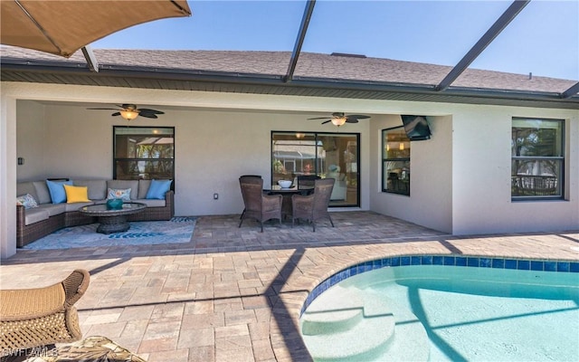 pool featuring a patio area, ceiling fan, and an outdoor hangout area