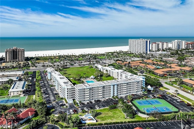 aerial view with a water view, a beach view, and a city view