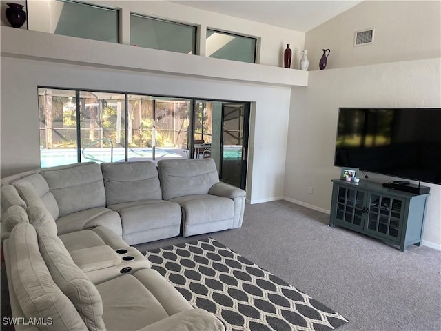 living room with baseboards, visible vents, carpet floors, and high vaulted ceiling