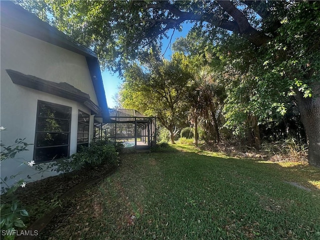 view of yard featuring a lanai