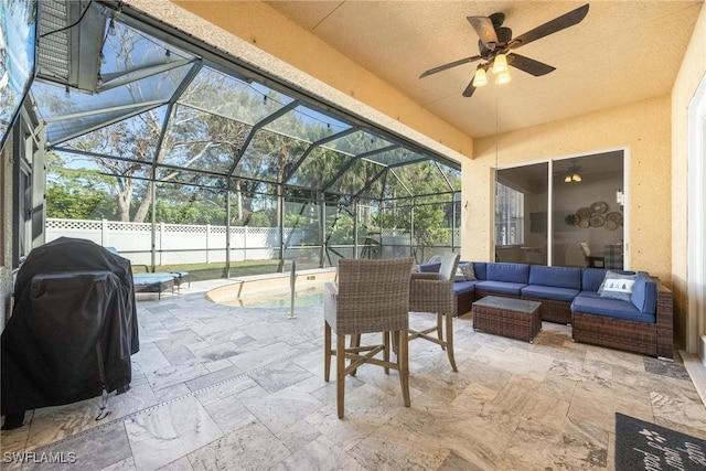 view of patio featuring area for grilling, an outdoor hangout area, ceiling fan, fence, and a lanai