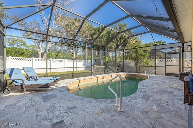 view of pool featuring a lanai, a fenced backyard, a fenced in pool, and a patio