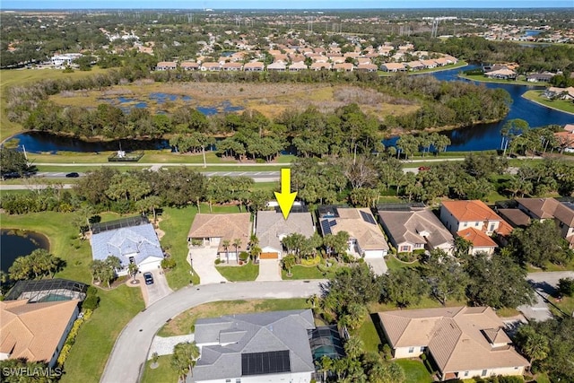 birds eye view of property featuring a residential view and a water view