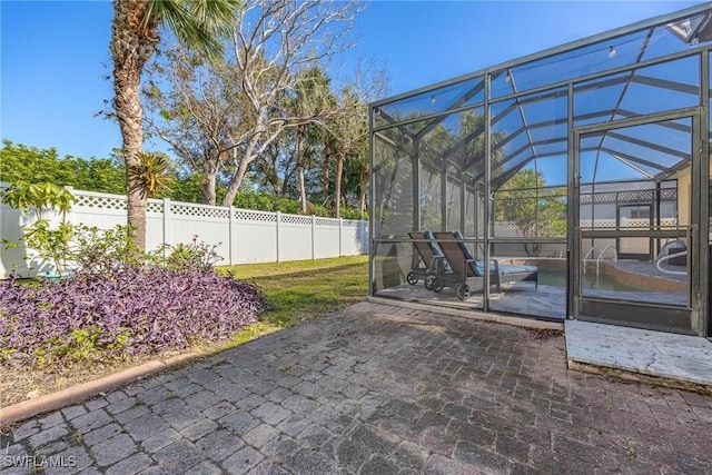 exterior space featuring fence private yard and a lanai