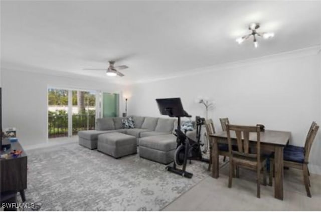 living room with ceiling fan and crown molding