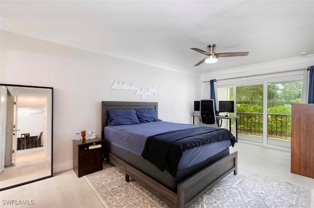 bedroom featuring access to outside, ornamental molding, light wood-type flooring, and a ceiling fan