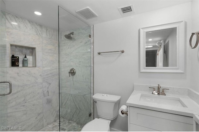 full bathroom featuring toilet, vanity, a marble finish shower, and visible vents