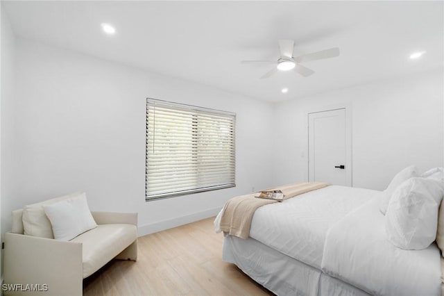 bedroom featuring a ceiling fan, light wood-type flooring, baseboards, and recessed lighting