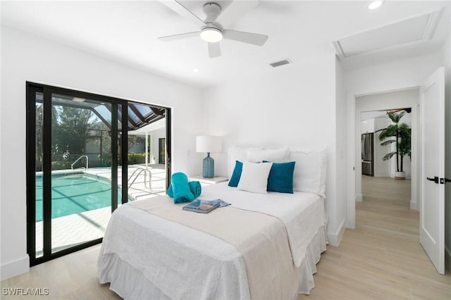 bedroom with light wood finished floors, access to outside, visible vents, and baseboards