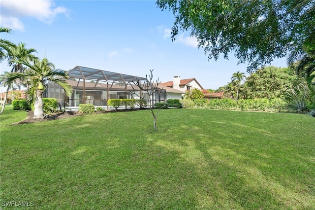 view of yard with a lanai