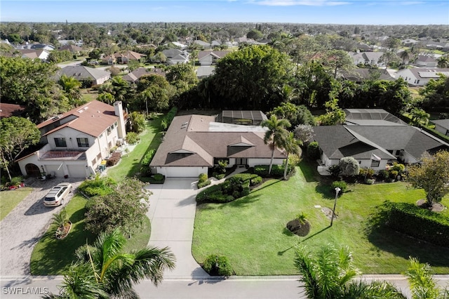 birds eye view of property with a residential view