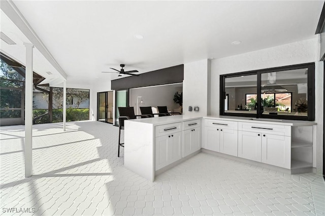 view of patio / terrace featuring ceiling fan and an outdoor kitchen