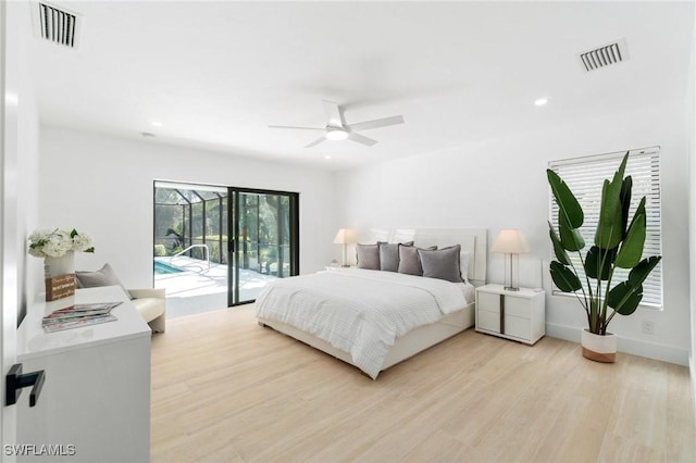 bedroom with access to outside, visible vents, light wood-style flooring, and recessed lighting