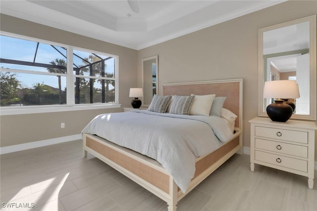 bedroom featuring light tile patterned floors, ornamental molding, a raised ceiling, and baseboards