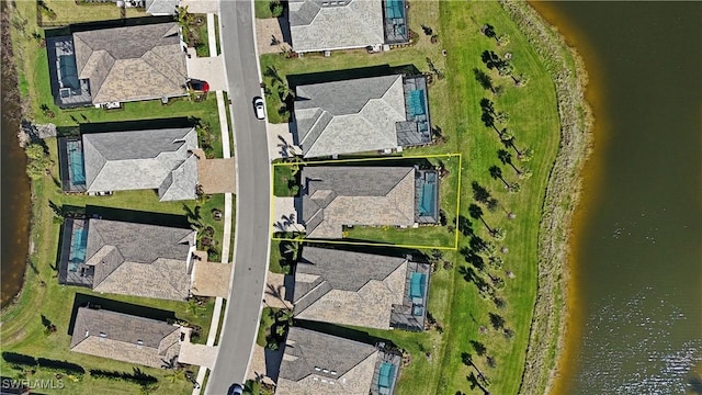 aerial view featuring a residential view and a water view