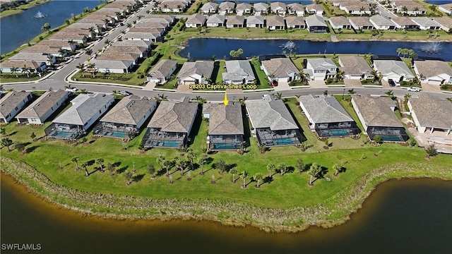 aerial view featuring a residential view and a water view