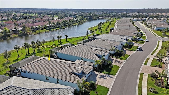 birds eye view of property featuring a residential view and a water view