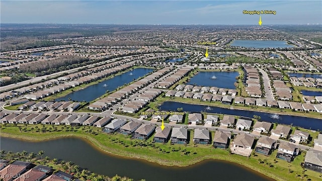 birds eye view of property with a residential view and a water view